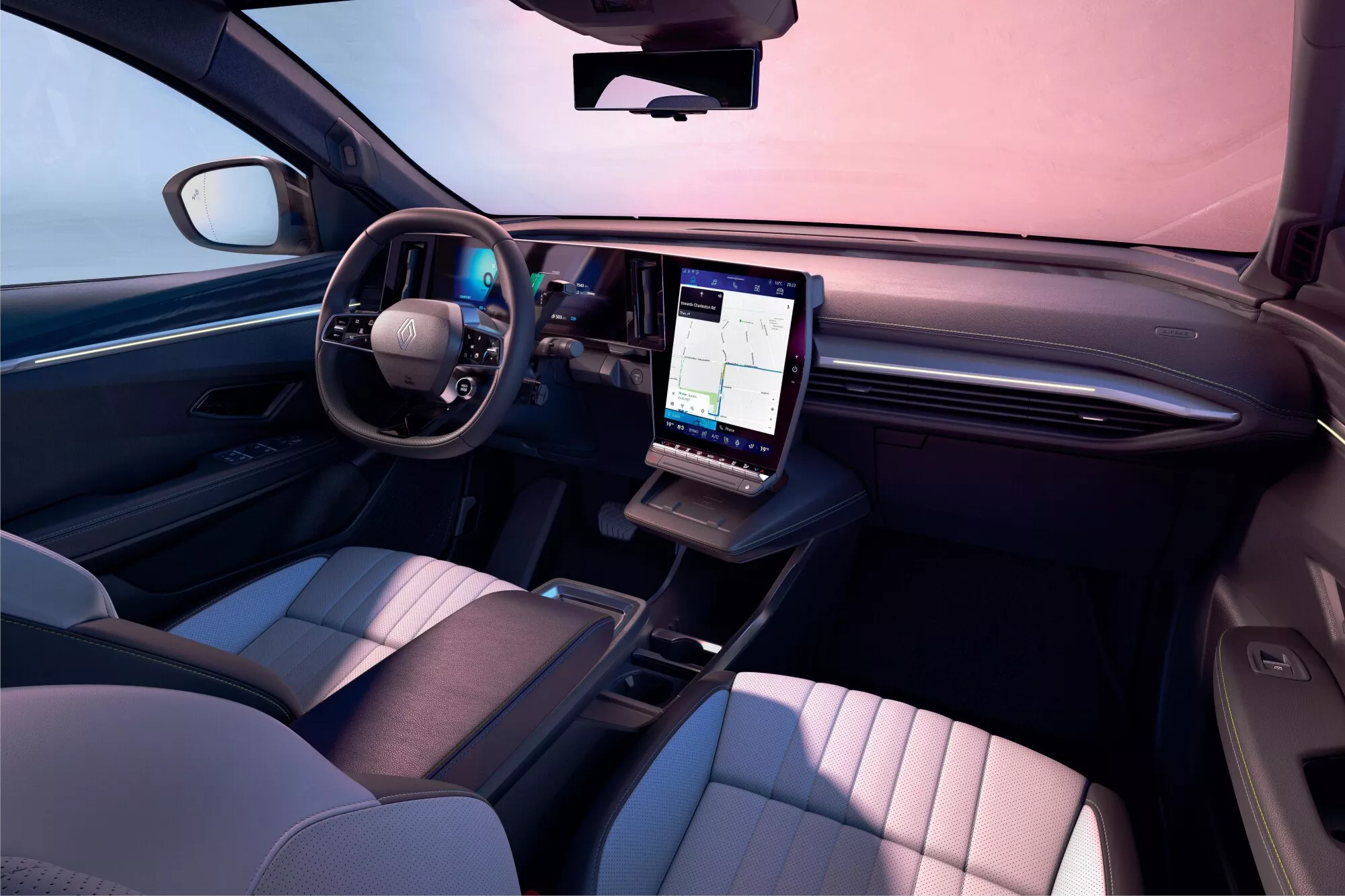 Vue de l'intérieur d'une Renault Scénic E-Tech, montrant le tableau de bord et l'écran d'infodivertissement.