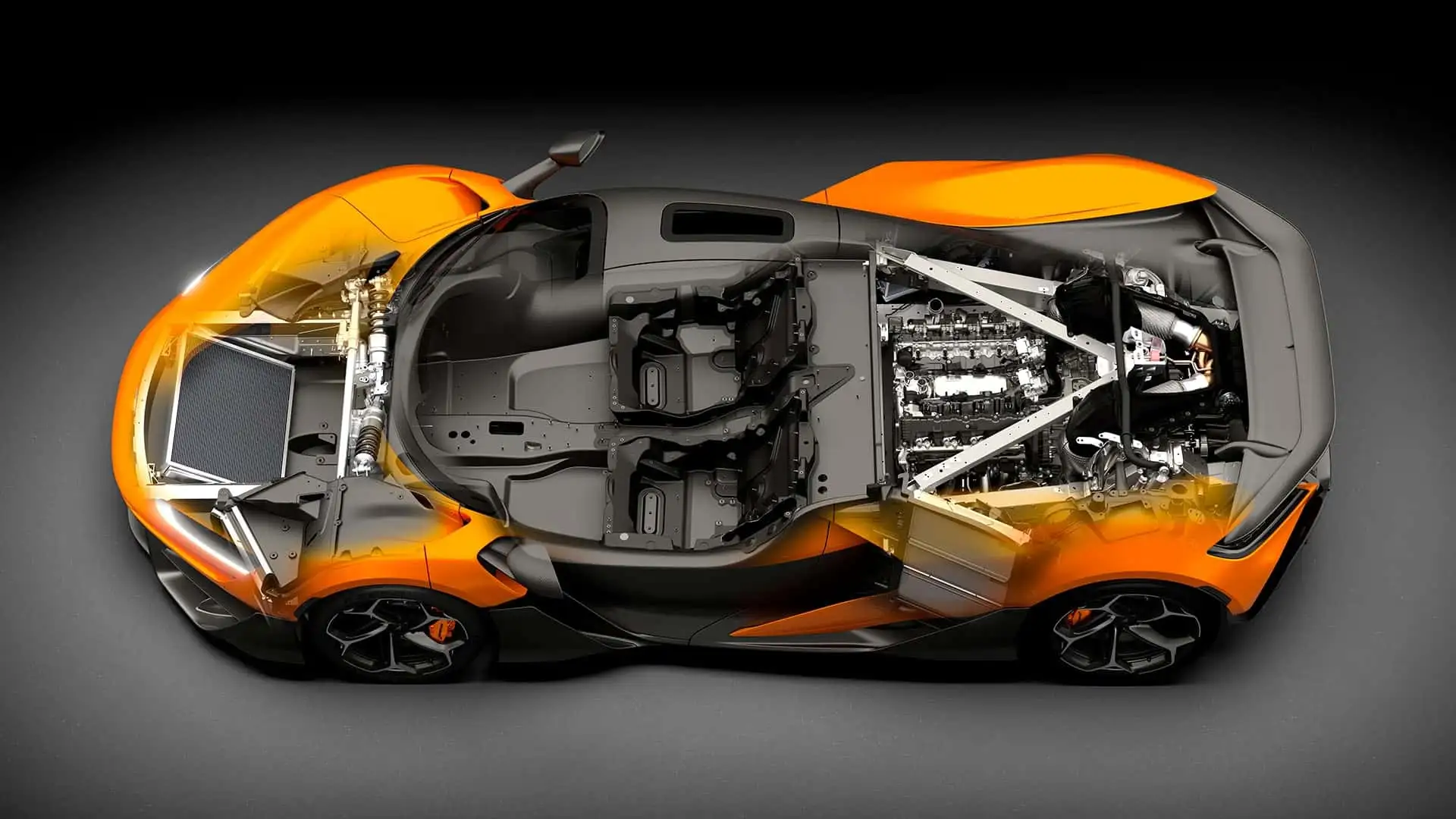 Gros plan sur le moteur hybride de la McLaren W1, montrant le moteur V8 et les composants électriques dans un compartiment moteur détaillé.