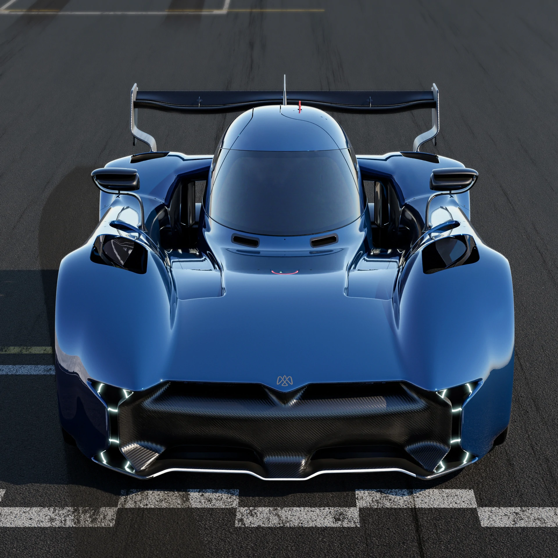 Une McMurtry Spéirling Pure blanche et noire, un véhicule électrique futuriste, roulant sur une route sinueuse avec un paysage montagneux en arrière-plan.