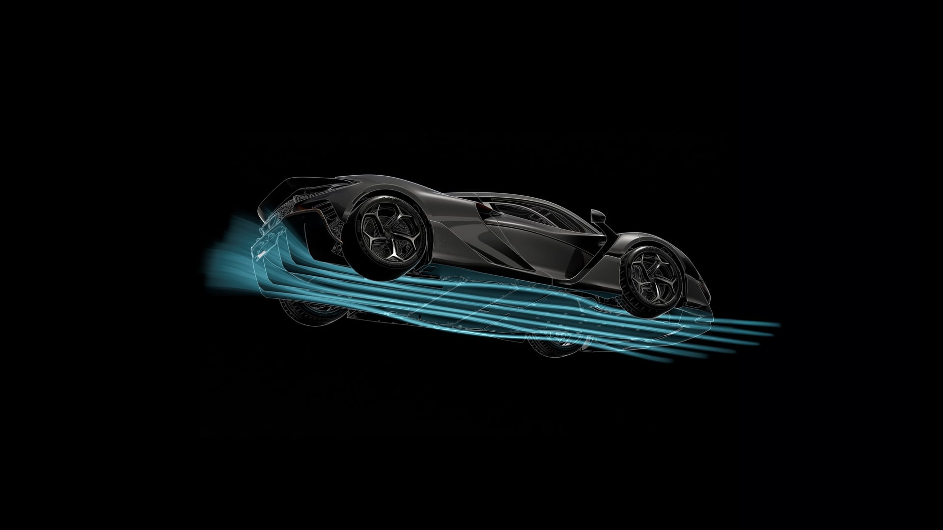 Vue dynamique de la McLaren W1 sur piste, mettant en évidence son design aérodynamique et ses canaux d'air.