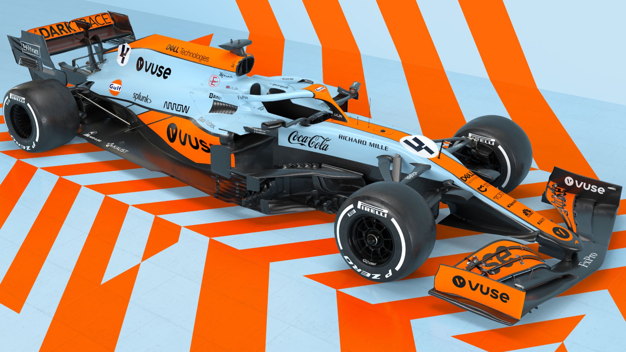 Gros plan sur la livrée rétro d'une McLaren F1, montrant les motifs géométriques et les bandes latérales subtiles.