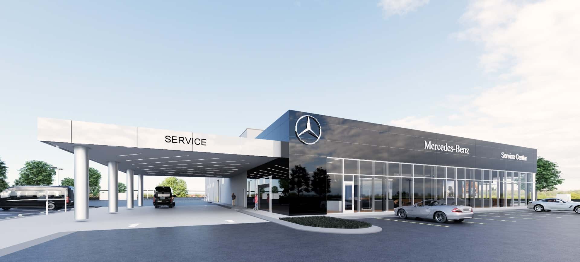 Un technicien automobile travaillant sur le tableau de bord d'une Mercedes-Benz dans un garage de concessionnaire.
