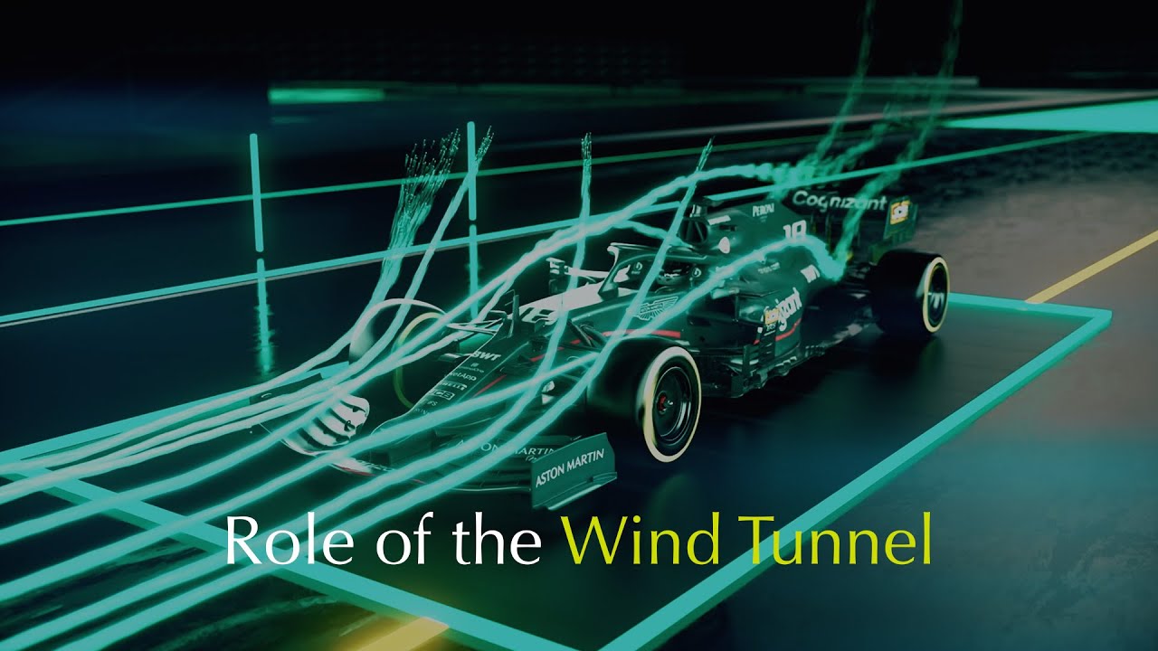 Une monoplace de Formule 1 en soufflerie, avec des faisceaux laser visualisant les flux d'air sur l'aileron avant.