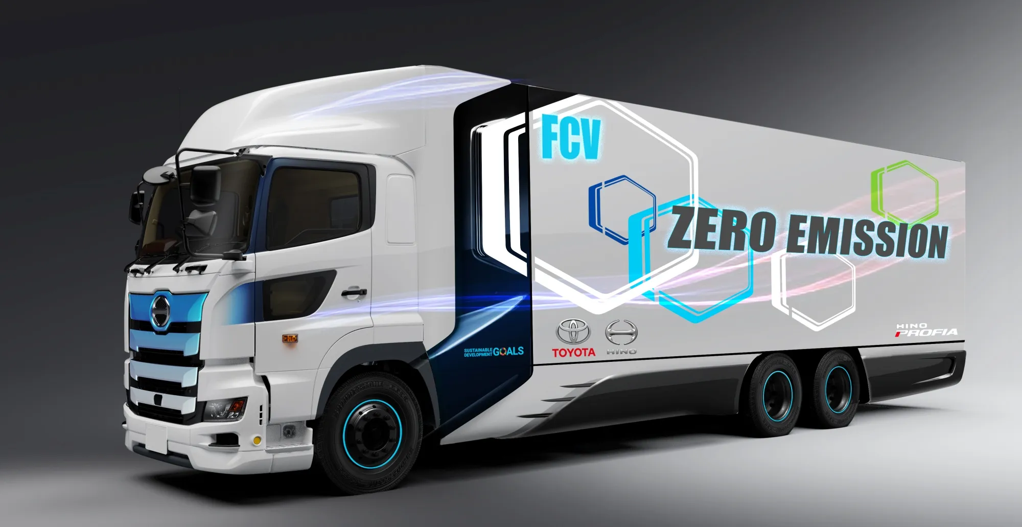 Une flotte de véhicules utilitaires Toyota à hydrogène, incluant un camion de livraison, un bus et un taxi, sur une autoroute.
