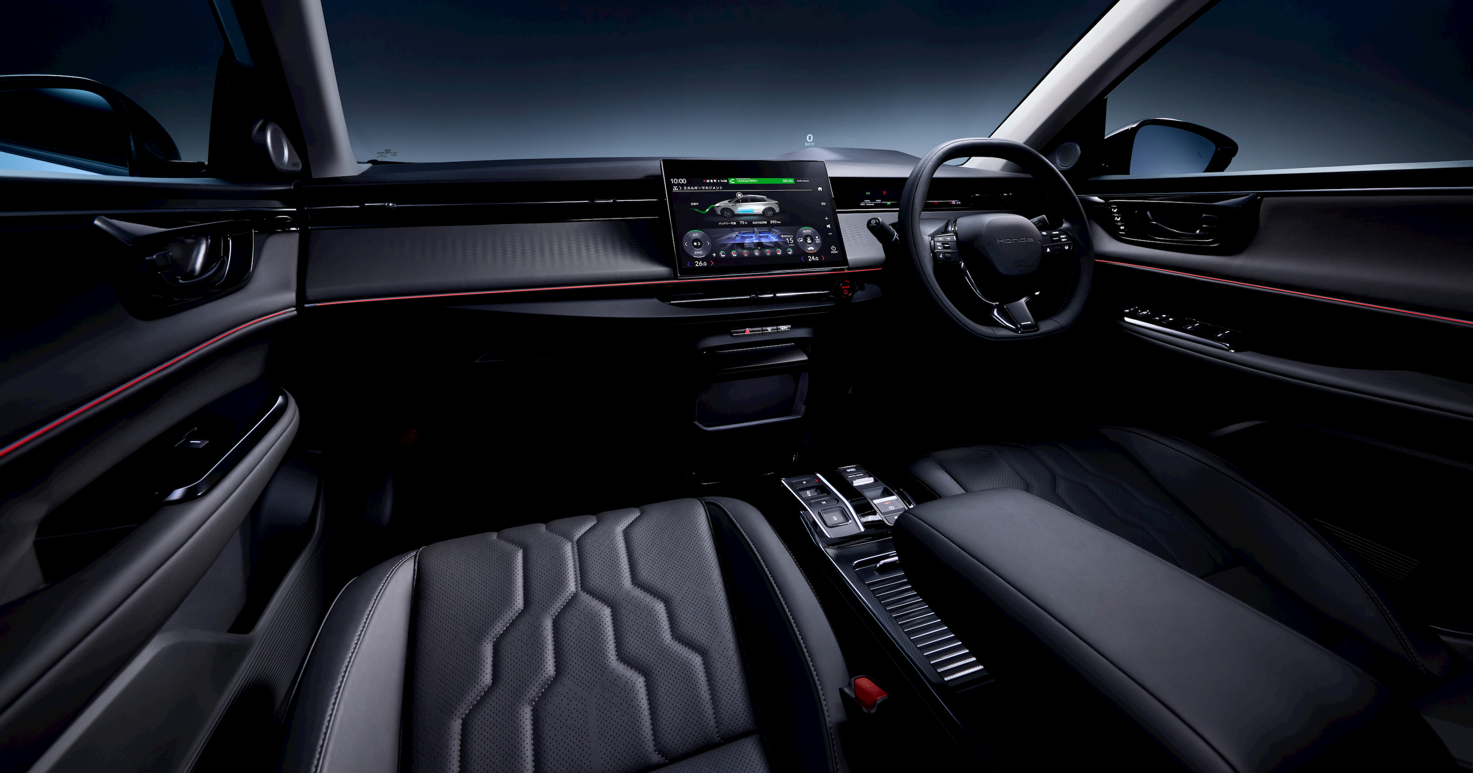 Intérieur de la Honda Insight électrique, montrant le tableau de bord avec un écran tactile central et des commandes ergonomiques.