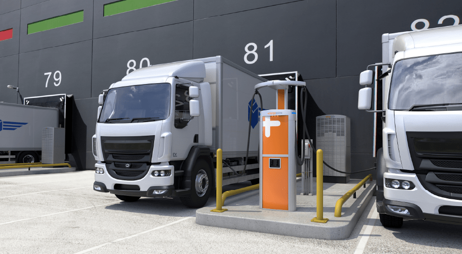 Image d'un véhicule électrique de flotte d'entreprise en train de se recharger à une borne, avec un arrière-plan urbain moderne.
