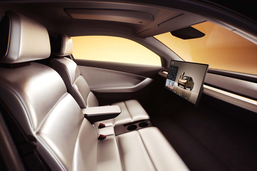 Vue intérieure du Tesla Cybercab, mettant en évidence l'absence de commandes traditionnelles et un design futuriste.