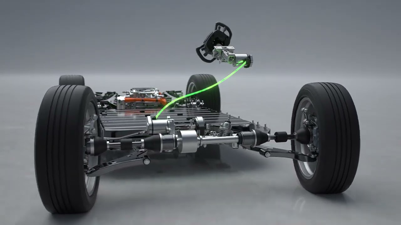 Gros plan sur le volant de type joug du Lexus RZ, illustrant la technologie steer-by-wire sans connexion mécanique.