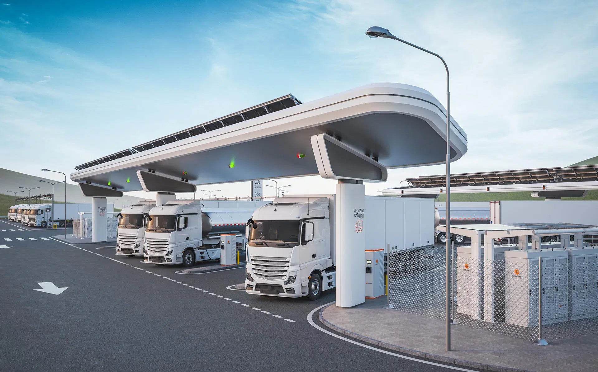 Image d'une station de recharge ultra-rapide pour véhicules électriques, avec plusieurs bornes et des voitures branchées, sous un ciel crépusculaire.