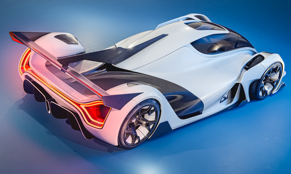Image d'un concept-car élégant et futuriste, avec des éléments de design suggérant une propulsion électrique et à hydrogène, dans un environnement de salon automobile.